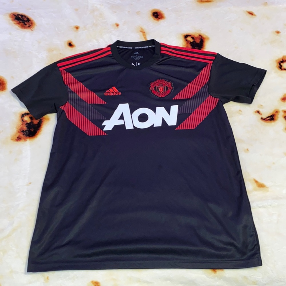 Adidas Manchester United. A black and red combo.